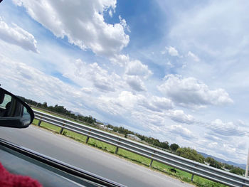 Scenic view of sky seen through car window