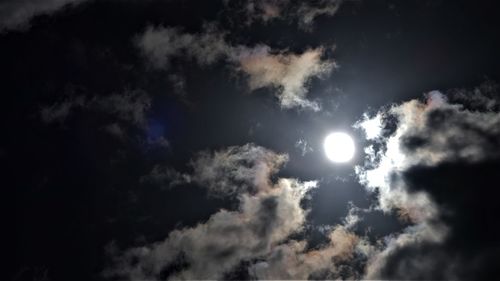 Low angle view of moon in sky at night