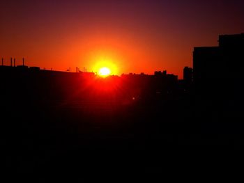 Silhouette of built structure at sunset