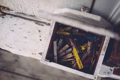 High angle view of clothespin in box