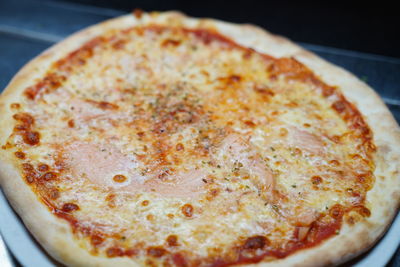 High angle view of pizza in plate on table