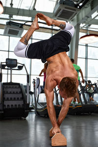 Low section of man exercising in gym