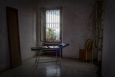 Empty chair in abandoned room