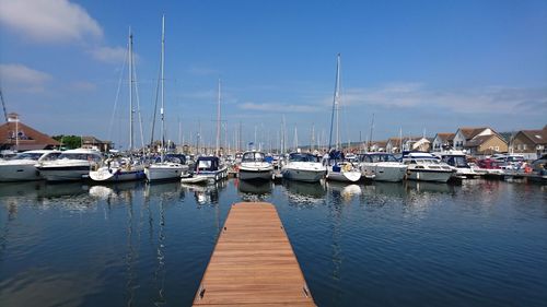 Boats moored at harbor