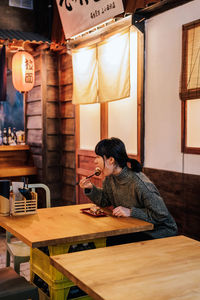 Woman sitting in restaurant