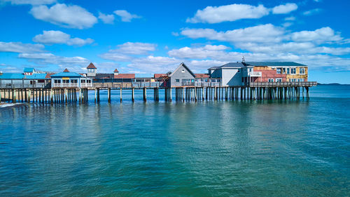 Pier over sea against sky