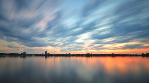 Scenic view of lake against sky during sunset