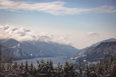 Scenic view of mountains against cloudy sky