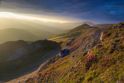 Scenic view of mountains against sky during sunset