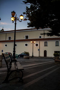 Cars on road against buildings