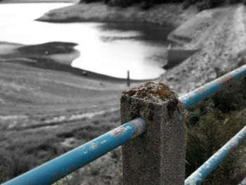 Close-up of rope tied to railing