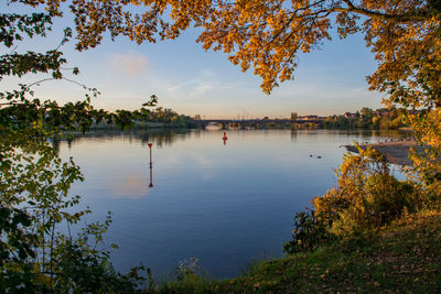 Scenic view of lake against sky during sunset