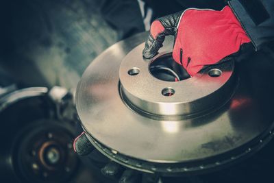 High angle view of `mechanic working at auto repair shop