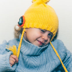 Close-up portrait of cute baby girl in snow
