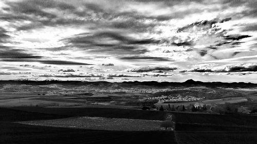 Scenic view of sea against cloudy sky