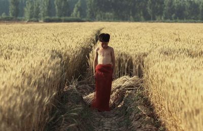 Full length of woman standing on field