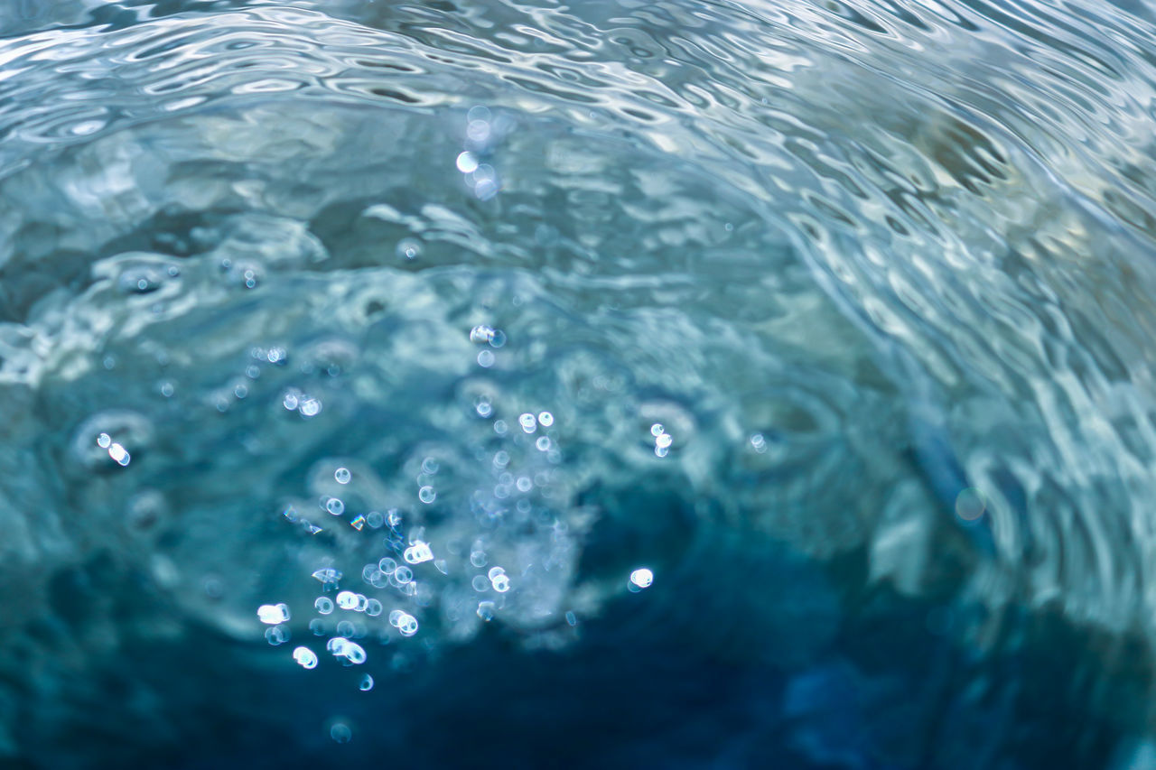 CLOSE-UP OF BUBBLES IN SEA