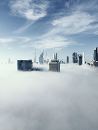 Modern buildings in city against sky