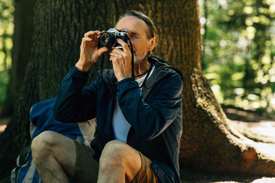 Man photographing through camera