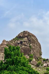 Low angle view of rock formation against sky