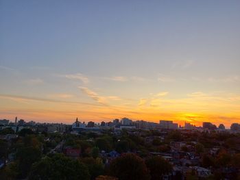 High angle view of buildings against sky during sunset