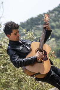 Young man playing guitar