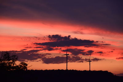 Silhouette landscape against sky during sunset