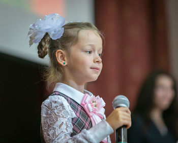 Portrait of a girl with pink flower