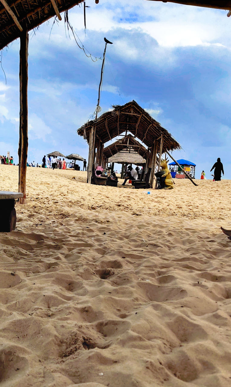 PANORAMIC VIEW OF BEACH HUT AGAINST SKY