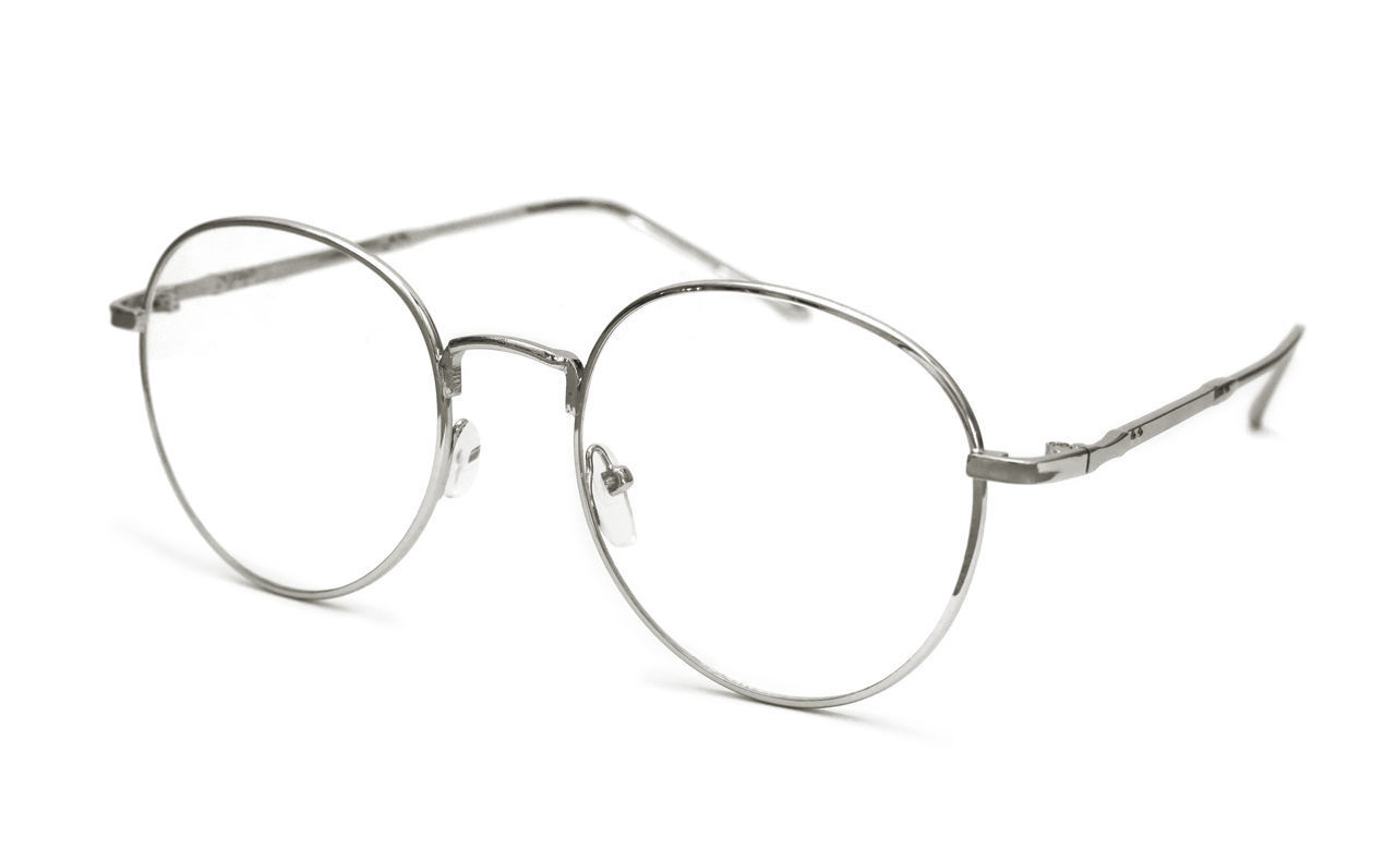 CLOSE-UP OF EYEGLASSES ON GLASS