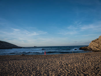 Scenic view of sea against blue sky