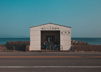Built structure on beach against clear sky