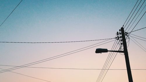 Low angle view of electricity pylon