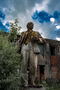 Low angle view of statue against sky