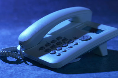 Close-up of telephone on table