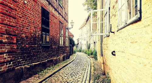 Narrow alley along built structures