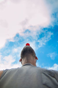 Rear view of man against sky