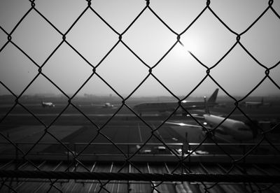 Full frame shot of chainlink fence against sky