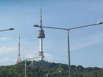 Low angle view of communications tower against sky