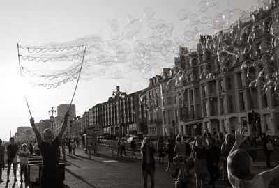 People walking on street in city