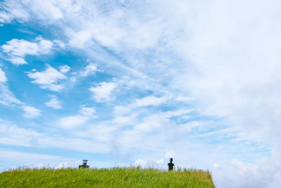 Man on field against sky