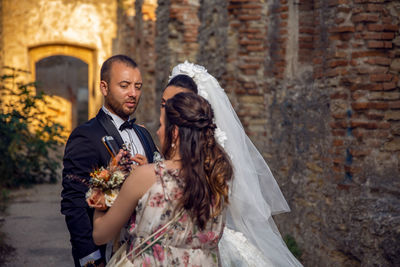 Full length of couple holding hands