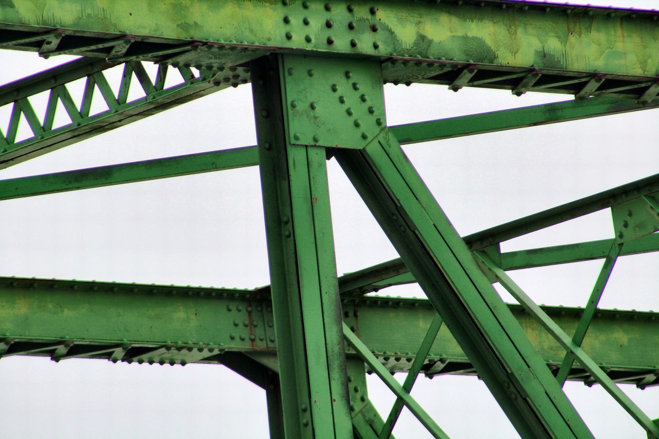 LOW ANGLE VIEW OF METALLIC BRIDGE AGAINST SKY