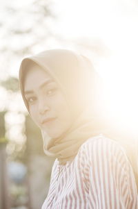 Side view portrait of woman wearing hijab during sunset