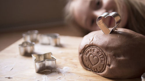 Close-up of girl preparing cookies