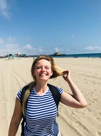 Portrait of smiling young woman on beach