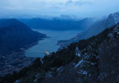 High angle view of mountains against sky during winter