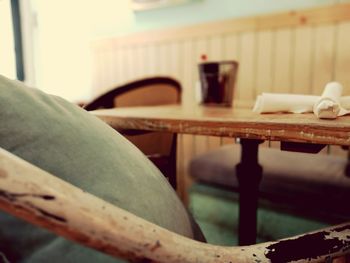 Close-up of empty chair on table at home