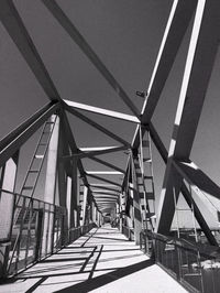 Low angle view of footbridge against clear sky