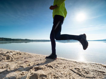 Fit and healthy man in sports clothing jogging outdoors. fitness outdoor, exercise.